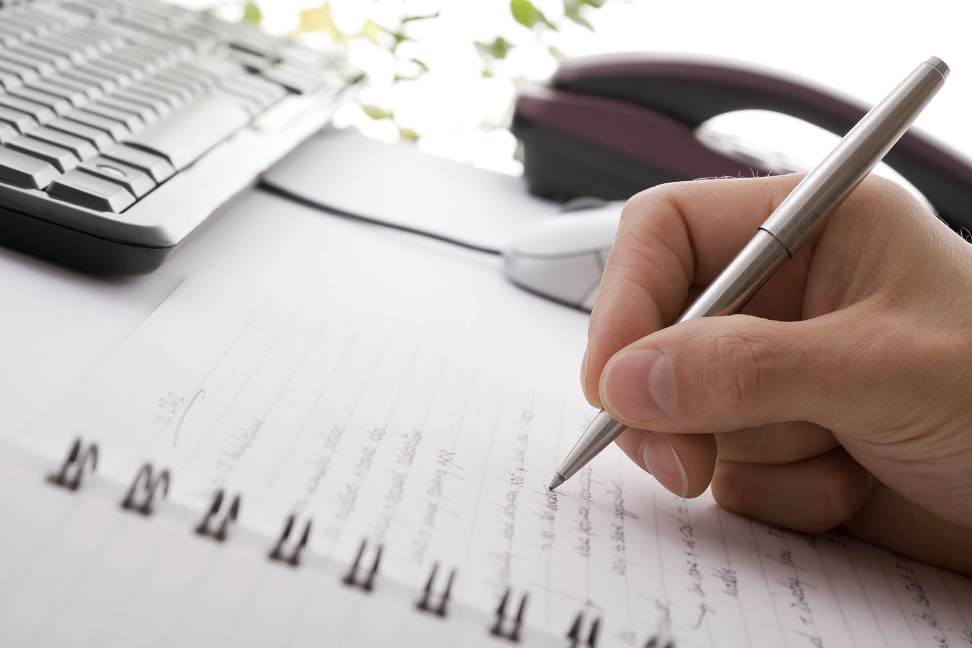 Businessman Brainstorming And Writing Notes